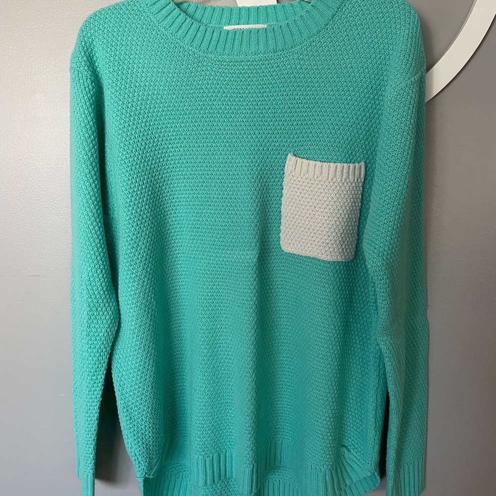 Teal sweater with white pocket